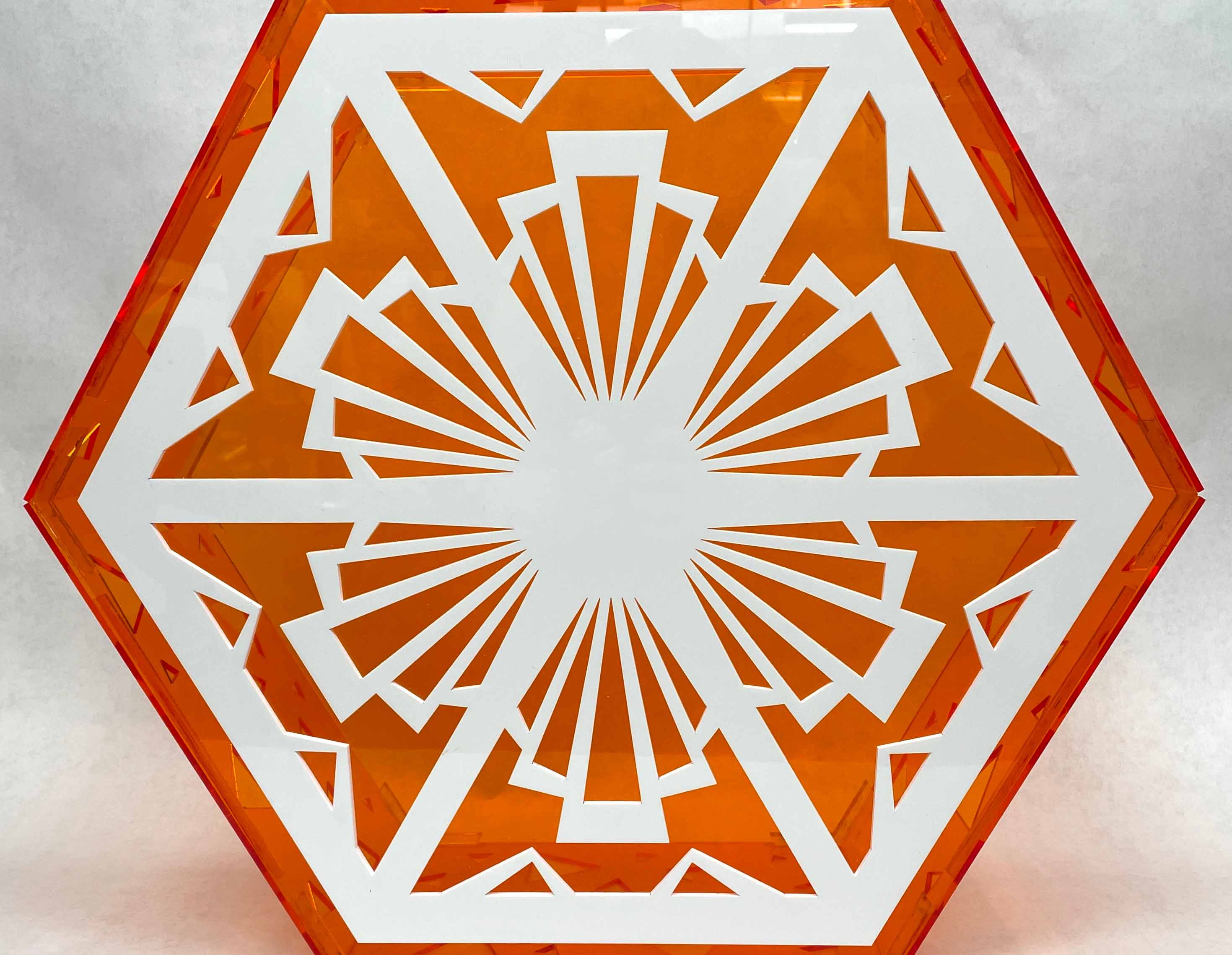 an image of an orange and white hexagonal prism made from acrylic